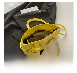 Interior view of yellow shell bag showing storage capacity for wallet and phone