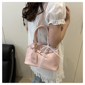Borsa a mano in pelle rosa con fiocco di pizzo bianco e tracolla regolabile per donna