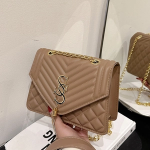 Quilted tan shoulder bag with gold metal hardware and elegant tassel detail for women