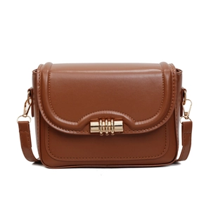 Brown vintage faux leather crossbody bag with wavy flap and golden cylindrical lock