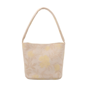 Minimalist white floral bucket bag with wide shoulder strap in cream and beige tones