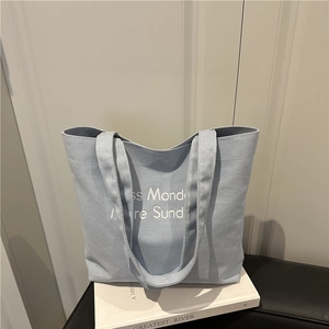 Retro canvas tote bag in light blue with Less Monday More Sunday print and dual handles