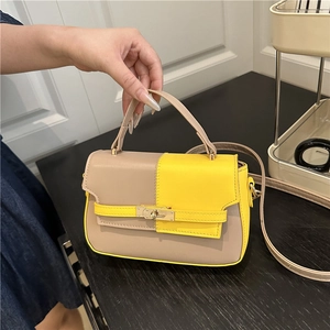 Chic color-block saddle handbag in beige and yellow with gold buckle for women