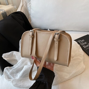 Minimalist beige PU leather shoulder bag with adjustable straps and fashion text
