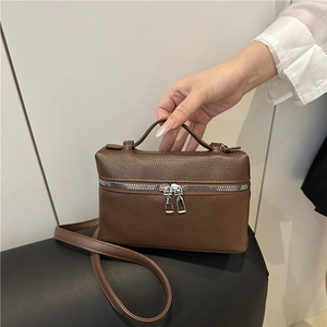 Brown lychee leather crossbody bag with top handle and double zipper closure