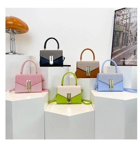 Detailed arrangement of stylish bicolor crossbody bags with woven texture and gold locks