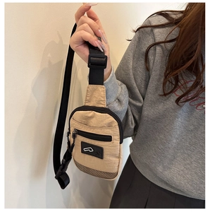 Detail of Harajuku style chest bag with adjustable black strap and mesh bottom detail