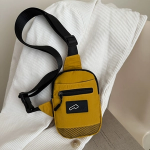 Minimalist bright yellow nylon crossbody chest bag with adjustable black strap and mesh detail