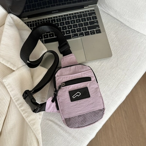 Minimalist lavender nylon chest bag with adjustable strap and textured surface