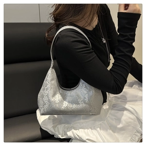 Close-up of silver snakeskin texture on a chic large shoulder tote bag for women