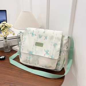 Sac bandoulière en toile blanche avec imprimé papillon vert et sangle réglable