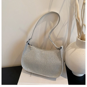 Detailed view of silver rhinestone hobo bag with sparkling finish and sleek zipper
