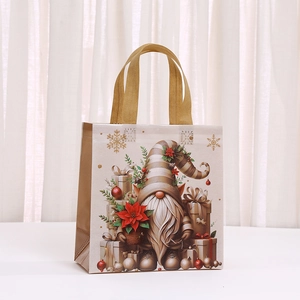Golden Christmas non-woven gift bag with gnome print and festive snowflake patterns