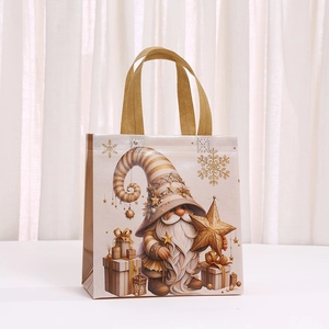 Detail of Christmas gnome gift bag with golden snowflakes and fabric handles