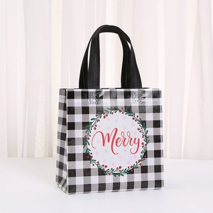 Christmas gift bag with black white checkered pattern and red Merry festive wreath