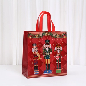 Foldable Christmas non-woven gift bag with red nutcracker design and sturdy handles