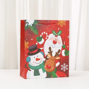 Festive red Christmas gift bag with cartoon Santa, snowman and reindeer illustrations