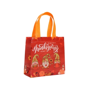 Red Happy Thanksgiving gift bag with gnomes and pumpkin prints on non-woven fabric