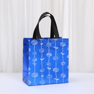 Borsa shopping blu laser in tessuto non tessuto con motivi floreali e manici