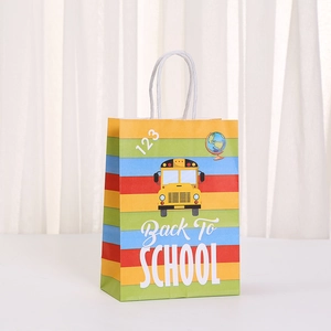 Detail view of Back to School gift bag with yellow school bus and colorful stripes