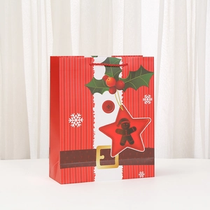 Red Christmas paper gift bag with Santa Claus belt design and red silk handles