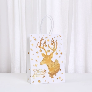 White Christmas paper gift bag featuring a golden reindeer and Merry Christmas text