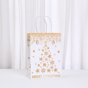 White Christmas paper gift bag with golden sparkling tree and Merry Christmas text