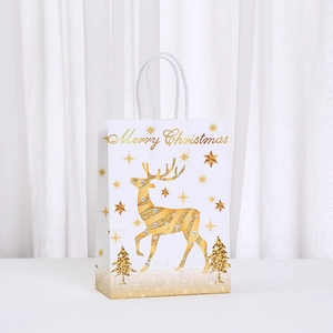 White and gold Merry Christmas paper gift bag with reindeer design and white rope handles