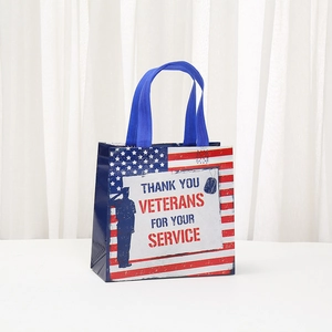 Laminated Veterans Day shopping bag with American flag design and soldiers silhouette