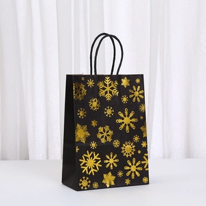 Black Christmas gift bag with gold foil snowflake pattern and durable rope handles