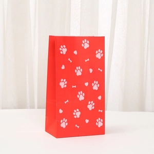 Red kraft paper gift bag with pink paw and bone prints for party favor packaging