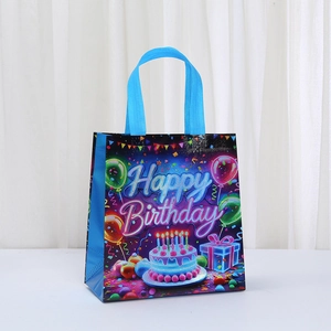 Blue non-woven Happy Birthday gift bag with cake, balloons and sturdy handles