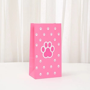 Pink paper gift bag with cute white paw prints for parties and shopping gifts