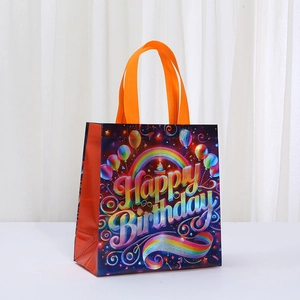 Laminated non-woven Happy Birthday gift bag with rainbow design and orange handles