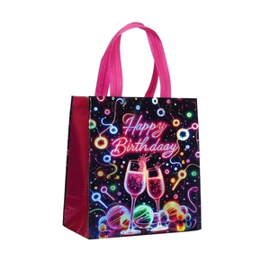 Neon Happy Birthday non-woven gift bag with pink handles and 3D festive pattern