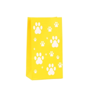 Yellow kraft paper gift bag with white paw print pattern and serrated top edge