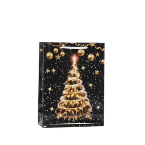 Elegant black Christmas gift bag with golden glowing tree design and white handles