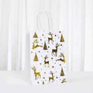 White Christmas paper gift bag with gold reindeer and tree foil print for holidays