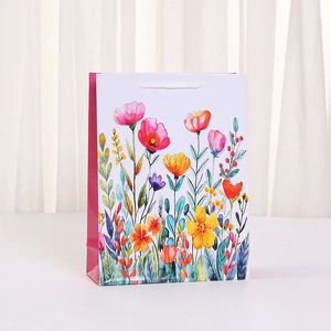 Macro detail of watercolor floral art print on premium paper gift bag with rope handles