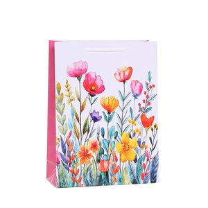 Floral print paper gift bag with pink sides and white watercolor flower illustrations