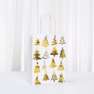 White Christmas gift bag with sixteen golden foiled trees on a minimalist background