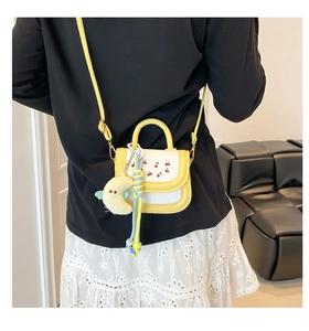 Mini yellow crossbody bag with cherry embroidery and cute moon plush charm decoration