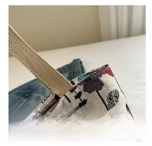 Macro detail of ethnic jacquard pattern and premium stitching on canvas tote bag