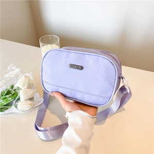 Minimalist lavender nylon crossbody bag with adjustable strap for daily casual commuting