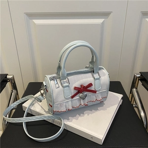 Elegant blue bow print underarm bag with lace trim and silver heart pendant detail