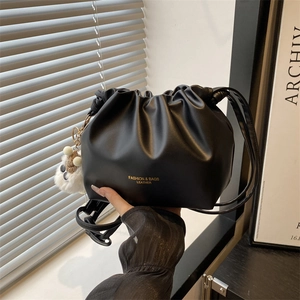 Minimalist black pleated cloud bucket bag in soft PU leather with a cute sheep charm