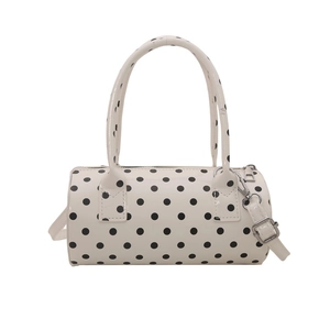 Polka dot cylinder bowling handbag in white and black with detachable shoulder strap