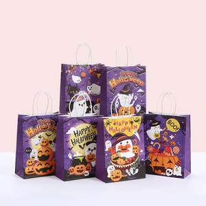 Detail of 6 Halloween gift bags featuring pumpkins and ghosts with white twist handles