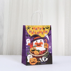 Detailed view of Halloween paper gift bag with purple ghost and pumpkin patterns