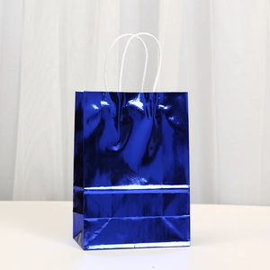 Metallic bright blue kraft paper gift bag with white twisted handles for shopping or party